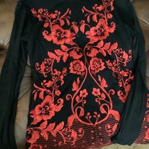 Black sheer blouse with beautiful red flowers design.